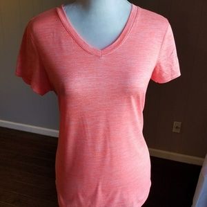 Short sleeved orange v neck top .